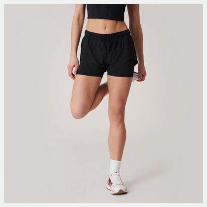 Bandier Woven tech Short | New Balance Clothing - Women